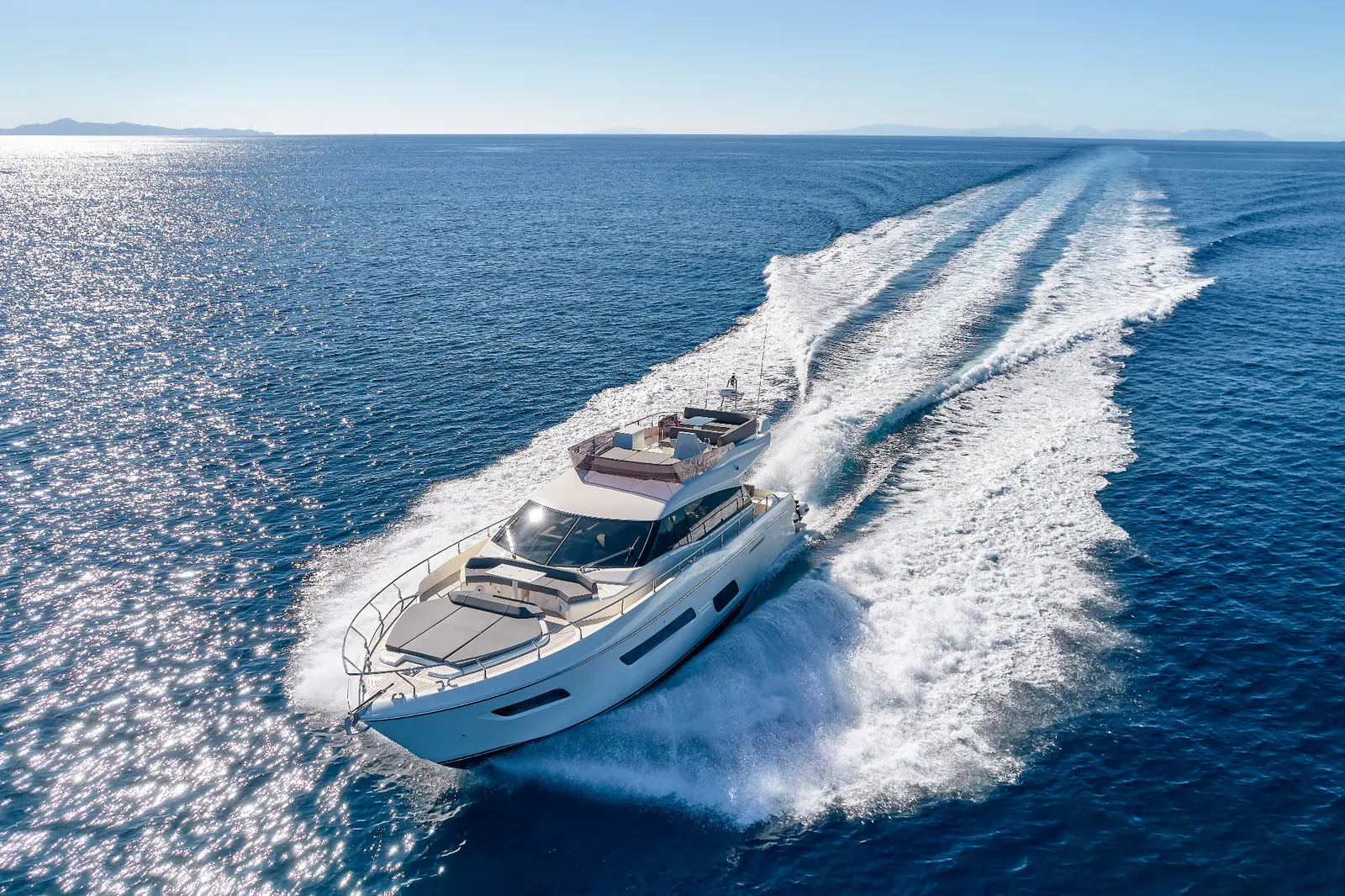 Ferretti 550 Flybridge motor yacht underway and represented by Alvea Yachts